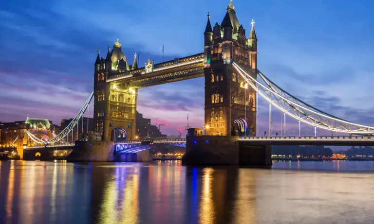 Tower Bridge in London lit up at dusk